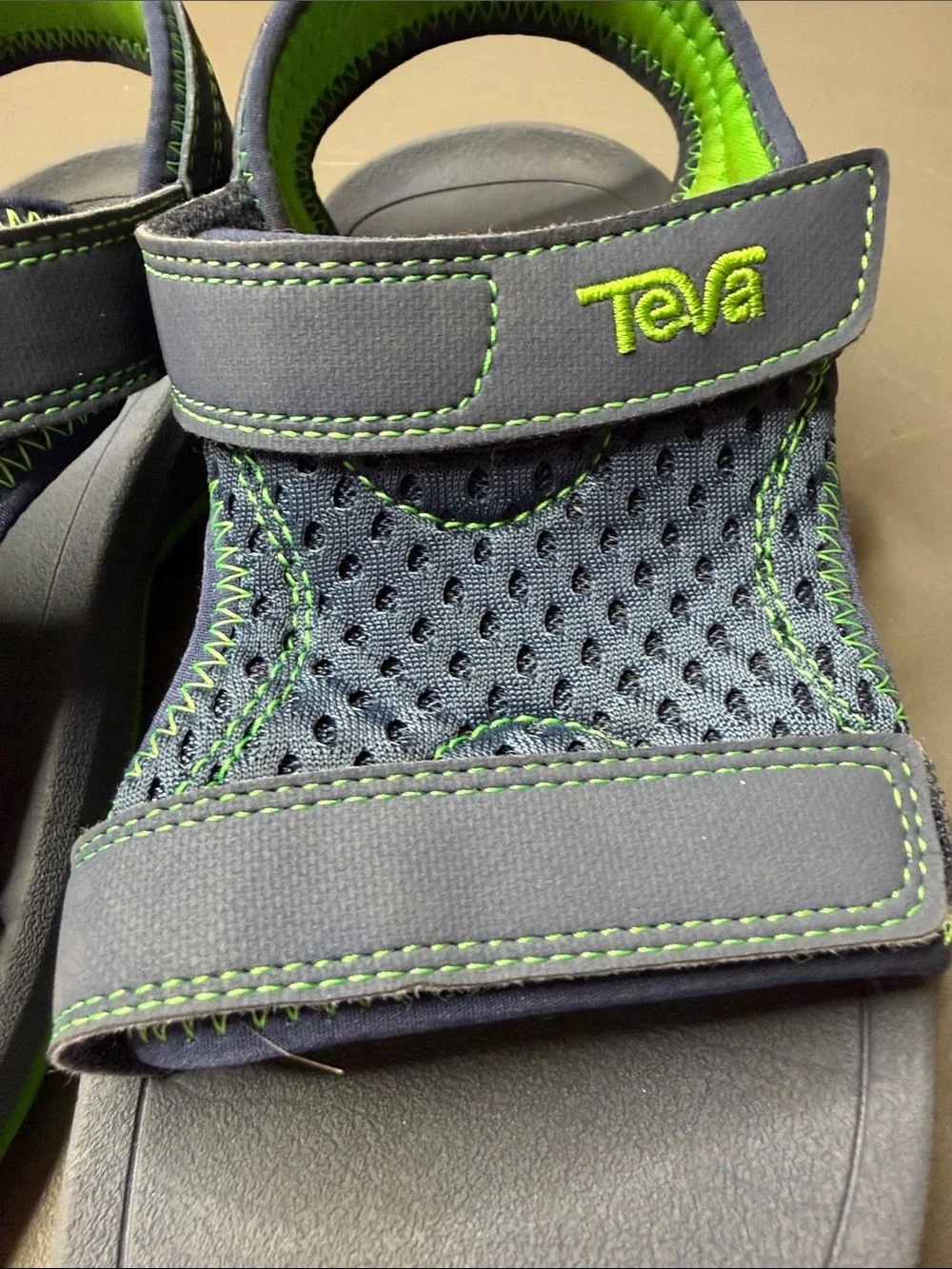 Kid’s Teva Navy and Bright Green Hook-and-Loop Sandals. Size: 2.